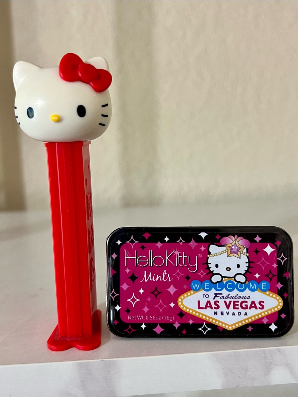 Collectible Hello Kitty Pez Dispenser and Pink Las Vegas Showgirl Mint Tin